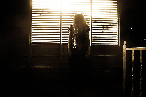 istock Ghost girl in haunted house 516419792