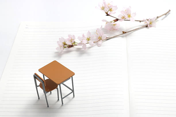 Study desk and cherry blossoms. Study desk and cherry blossoms on the notebook. high school enrollment stock pictures, royalty-free photos & images
