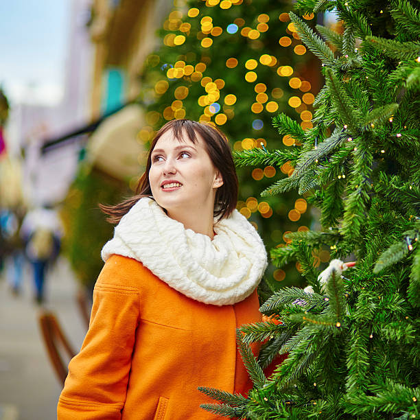 istock Cheerful young woman in Paris on a winter day 516420464