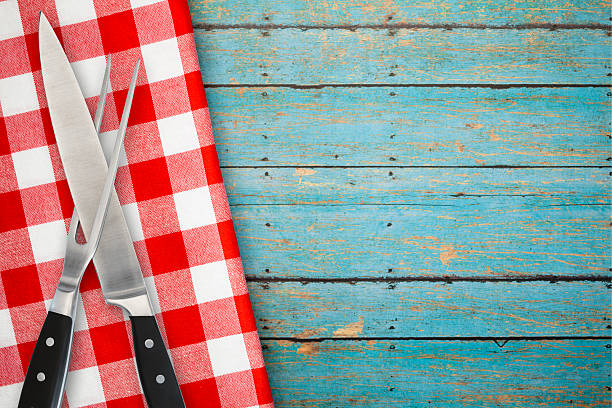 istock Carving Set of Fork and Knife on Blue Rustic Background 516421316