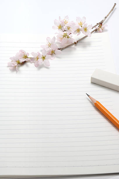 Cherry blossoms and writing utensils. Cherry blossoms and writing utensils on the notebook. high school enrollment stock pictures, royalty-free photos & images
