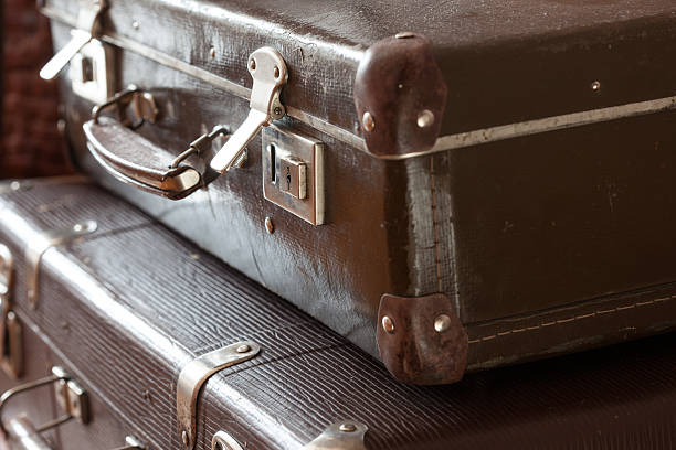 istock stack of vintage retro suitcases closeup 516424896