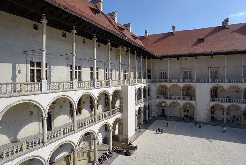 Krakow, Poland - September 15, 2013: Tourists in the Wawel royal castle. Built in the XVI century, now the castle is the museum and the main attraction of the city