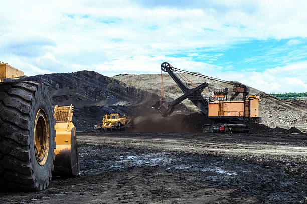 istock Haul Trucks being loaded with ore. 516427267