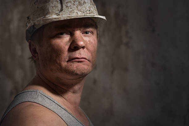 istock man in a helmet miner 516428338