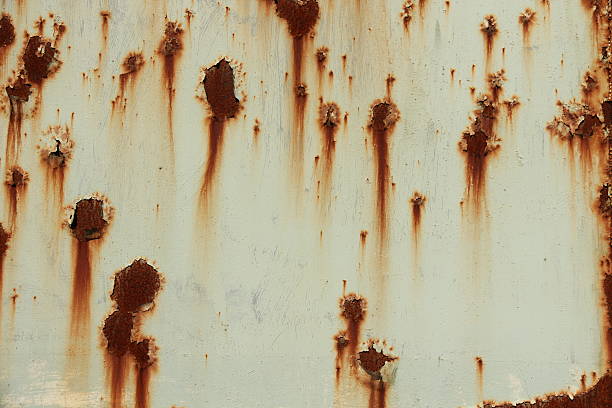 istock Rusty sheet of white painted steel 516439195