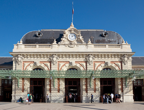 Nice, France - June 1, 2014: Gare de Nice - Ville is main railway station in Nice, completed in 1867 by architect Louis Bouchot and served by intercity and high speed TGV trains. Tourists coming and going from the station.