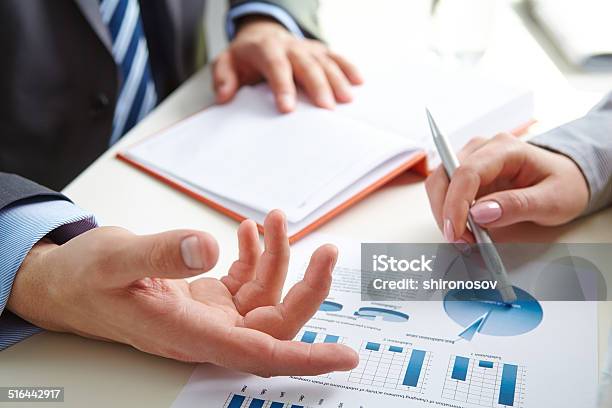 Paper Discussion Stock Photo - Download Image Now - Business, Business Meeting, Busy