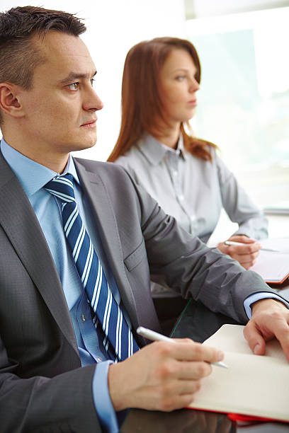 istock Businesspeople at conference 516442925