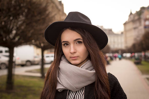 istock Closeup portrait of a brunette model in hat 516444136