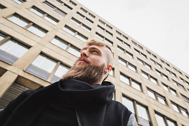 istock Stylish bearded man posing in the street 516445324
