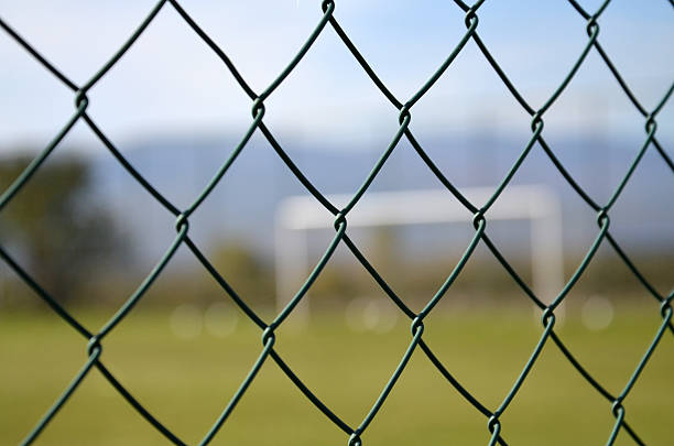 istock wire fence against soccer goal 516445642