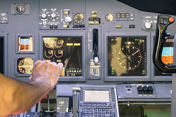 Captain hand accelerating on the throttle in commercial airliner Captain hand accelerating on the throttle in commercial airliner flight simulator - Cockpit thrust levers on the phase of takeoff throttle stock pictures, royalty-free photos & images