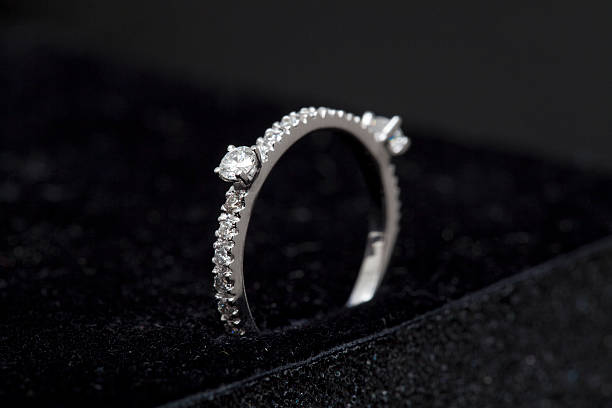 istock Close Up White Gold Diamond Ring on Black Background 516445914