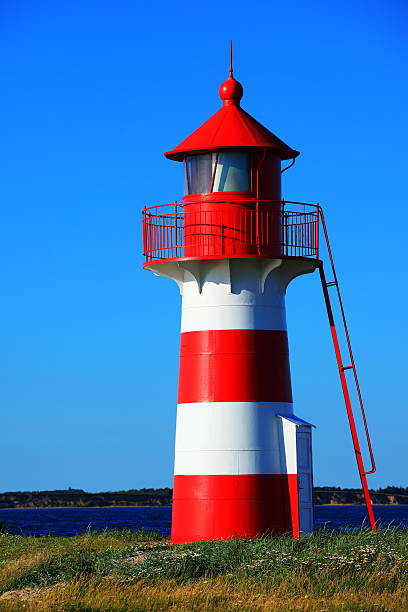 istock Lighthouse in red and white at Grisetaa Odde 516446189