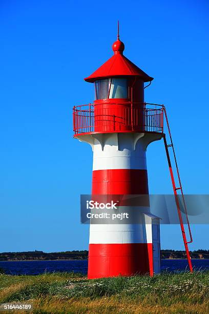 Lighthouse In Red And White At Grisetaa Odde Stock Photo - Download Image Now - Bay of Water, Beacon, Building Exterior
