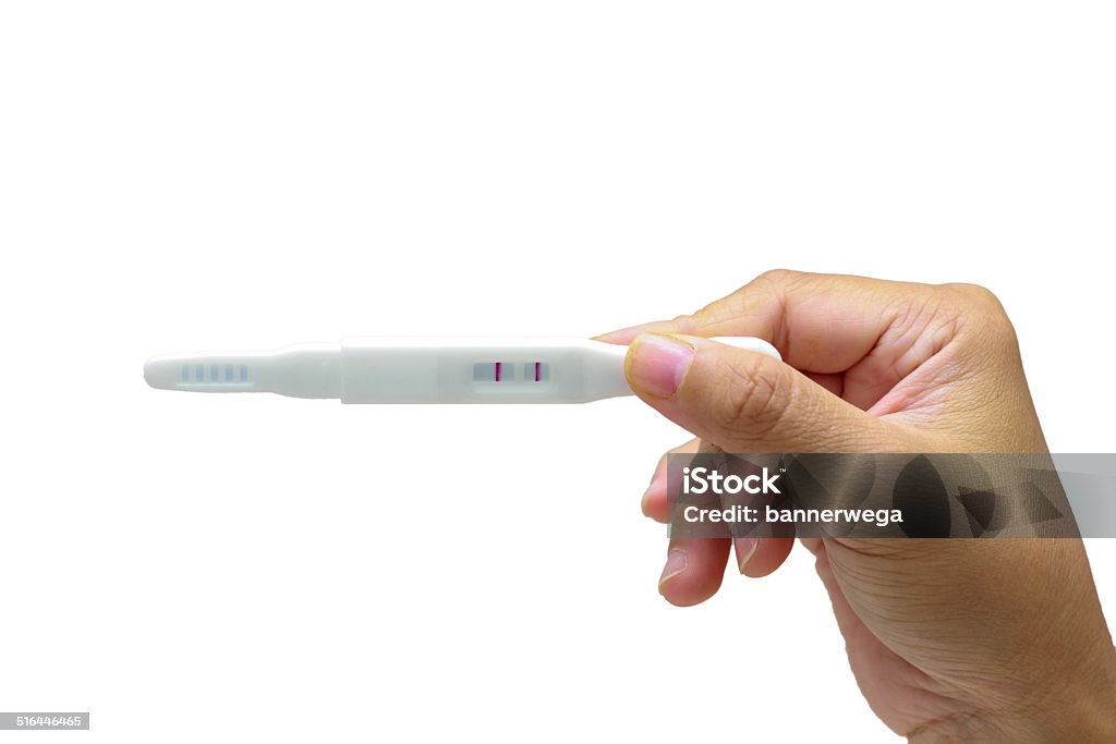 Pregnancy test stick Pregnancy test stick showing dual line positive sign. Adult Stock Photo