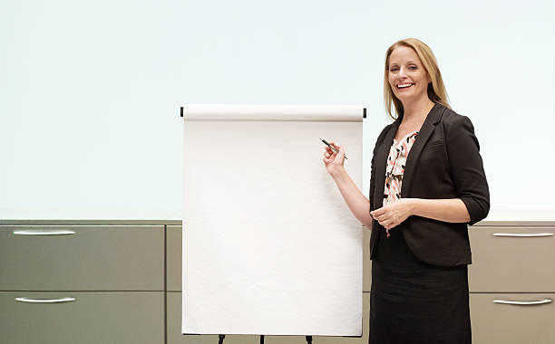 istock Smiling businesswoman presenting 516446760