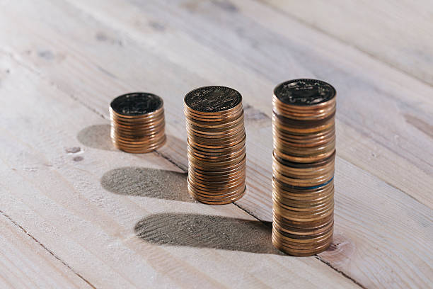 istock Graph from coins showing an upward trend in business. 516447710