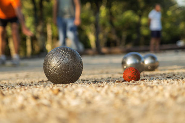 Ball Game / Petanque Playing Boules Game / Petanque in France traditional sport stock pictures, royalty-free photos & images