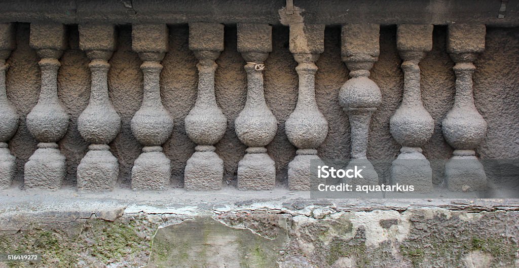 Bas relief of stone balustrade with one banister inverted Bas relief of stone balustrade with one banister inverted. Baluster Stock Photo