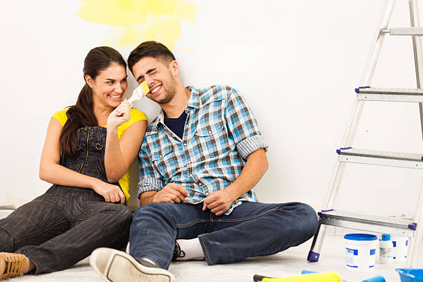 istock Young couple redecorating their new home 516449740