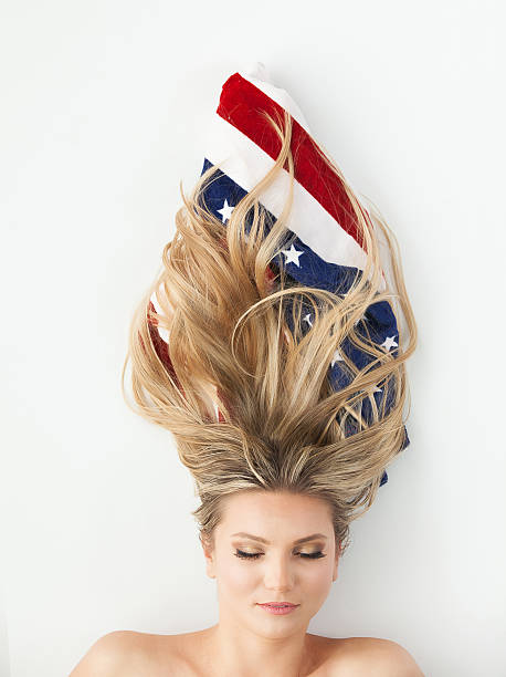 istock Beautiful woman with American flag 516449996