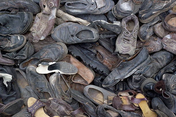 istock lot of old trash shoes. Background image 516450146