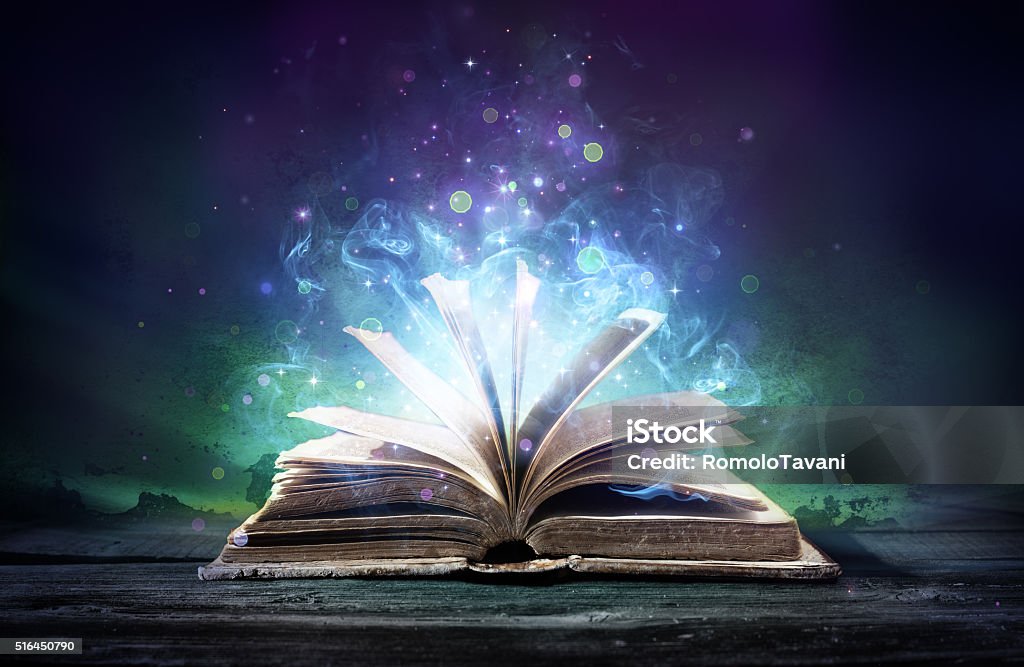 Bewitched Book With Magic Glows In The Darkness Aged Book With Bewitched Lights Book Stock Photo