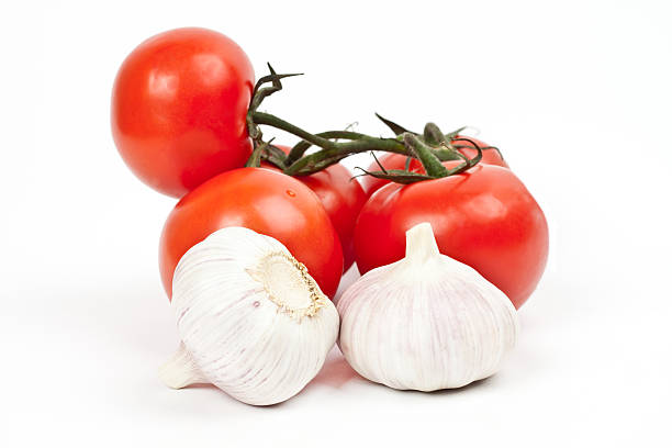 istock lot of tomatoes and garlic 516451482