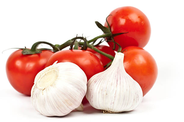 istock lot of tomatoes and garlic 516451502