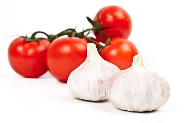 istock lot of tomatoes and garlic 516451550