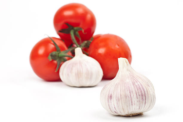 istock lot of tomatoes and garlic 516451612
