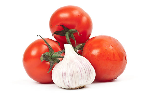 istock lot of tomatoes and garlic 516451634