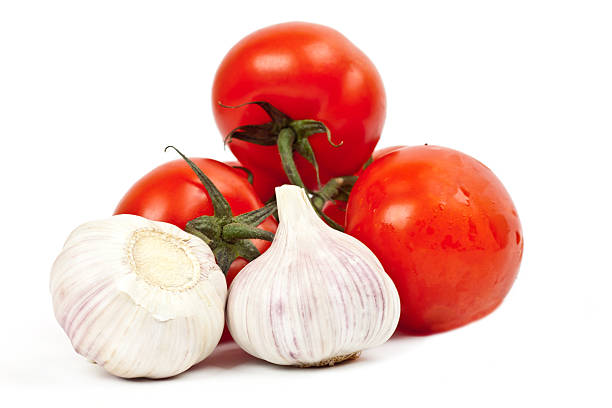 istock lot of tomatoes and garlic 516451658