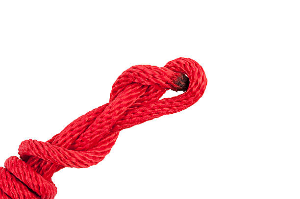istock Red Rope in A Knot Isolated on White Background. 516452346