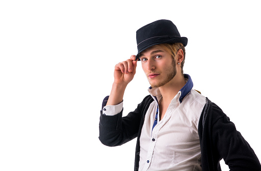 Headshot of handsome blond young man, blue eyes wearing fedora hat, isolated on white background