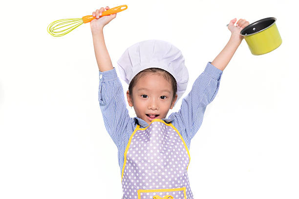 istock Little girl cooking 516456544
