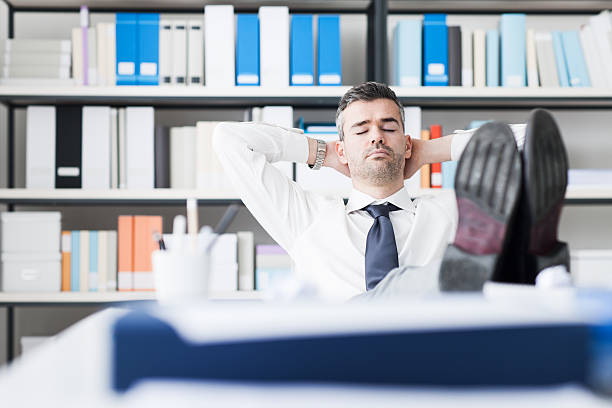 istock Businessman sleeping in the office 516457466