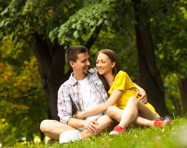 istock Young couple in park 516460595