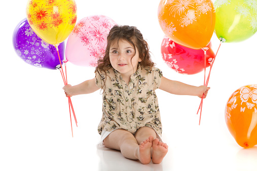 Smiley and beautiful girl with balloons