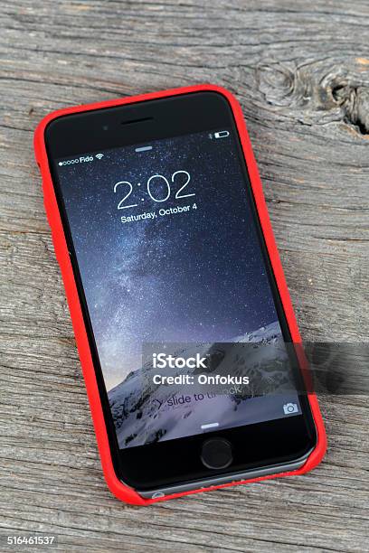 Apple Iphone 6 Inside Red Case Isolated On Wood Background Stock Photo - Download Image Now