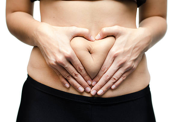 istock Woman hands make heart shape on stomach 516461713