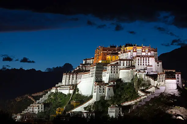The Potala Palace at night in Lhasa city of Tibet, China