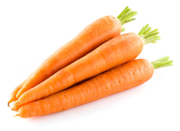 istock Heap of carrots isolated on white 516462665