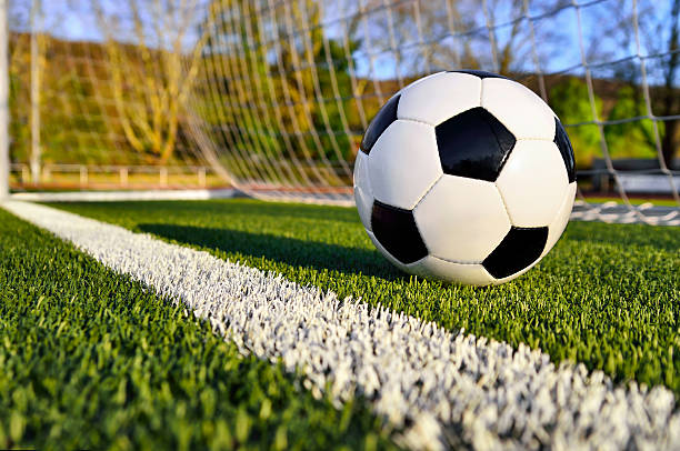 istock Soccer ball behind the goal line 516463479
