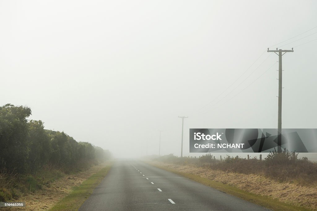 Country Road Country Road in Central South Island, through the mountains on a clear winter day. Asphalt Stock Photo