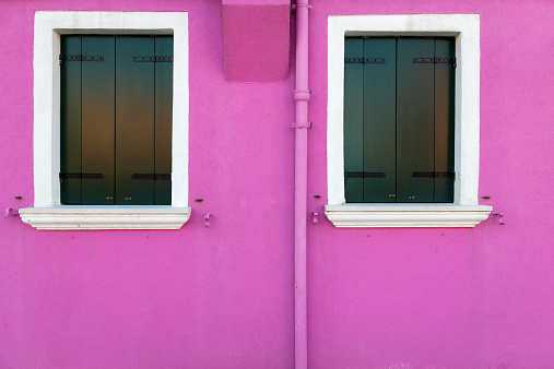 Colored windows in Burano, one of the little islands of Venice, Italy, Europe.