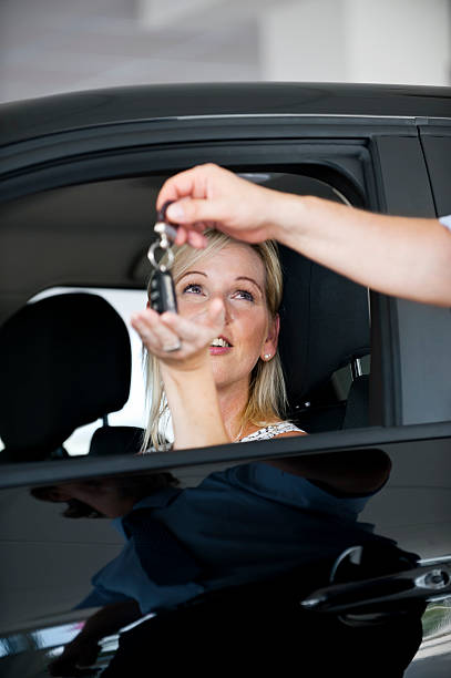 istock Woman with new car keys 516466523