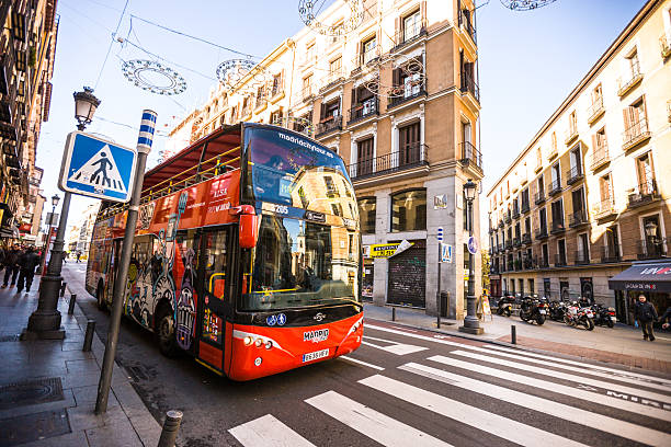 Madrid, Spain - December 22, 2013: Tours Bus on Madrid street, Spain. Few people on the streets.